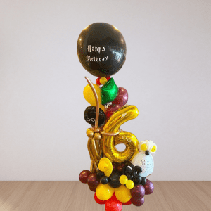 A magical Harry Potter-themed 6th birthday balloon decoration featuring balloons shaped like Harry Potter character.